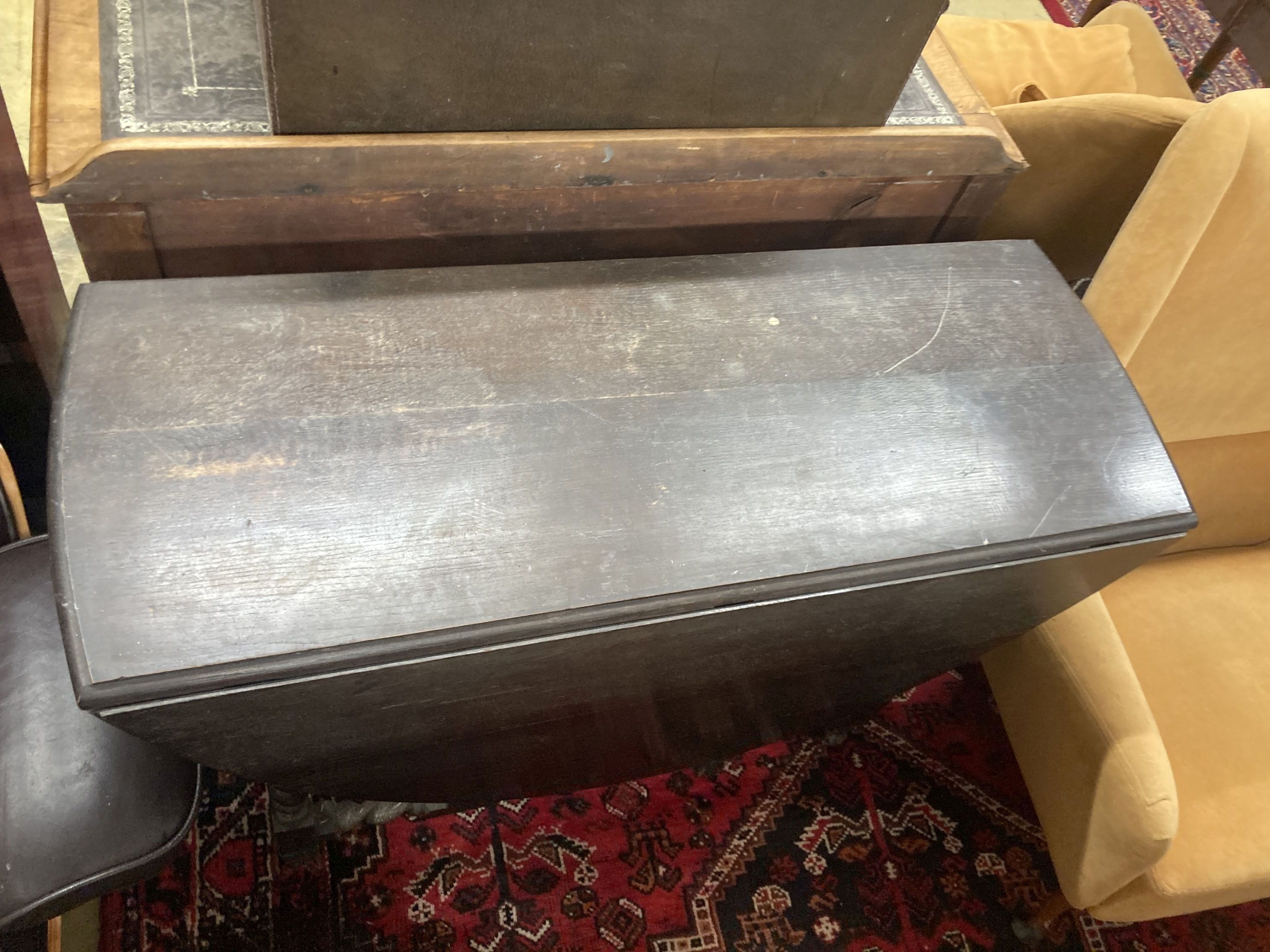 A 1920's oak topped gateleg dining table, on spiral twist legs, width 106cm, depth 40cm, height 76cm